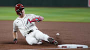 Arizona Diamondbacks base runner Corbin Carroll (7) slides back in safely to first base against the Los Angeles Dodgers at Chase Field in Phoenix, on Sept. 24, 2025.