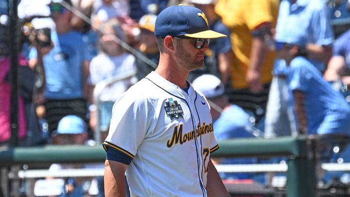 Jun 17, 2026; Omaha, NE, USA;  West Virginia Mountaineers head coach Steve Sabins walks to the dugout before the game against the North Carolina Tar Heels at Charles Schwab Field. Mandatory Credit: Steven Branscombe-Imagn Images