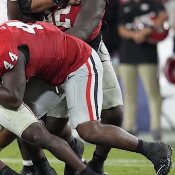 Sep 27, 2025; Athens, Georgia, USA; Georgia Bulldogs defensive lineman Jordan Hall (44) tackles Alabama Crimson Tide running back Jam Miller (26) in the fourth quarter at Sanford Stadium. Mandatory Credit: Dale Zanine-Imagn Images
