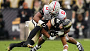 Ohio State Buckeyes linebacker Sonny Styles (0) tackles Purdue Boilermakers running back Antonio Harris (22)