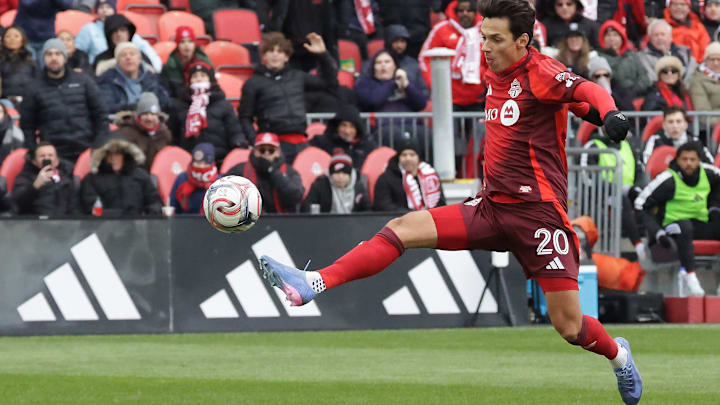 Daniel Salloi chips the ball over NYRB keeper Ethan Horvath to open the scoring.