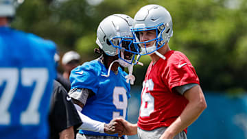 Detroit Lions wide receiver Jameson Williams (9) shakes hands with quarterback Jared Goff (16) at practice during mini camp at Detroit Lions headquarters and practice facility in Allen Park on Tuesday, June 4, 2024.