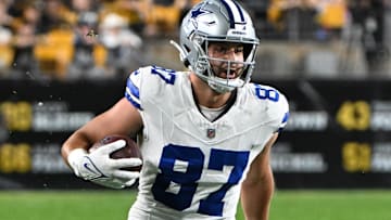 Oct 6, 2024; Pittsburgh, Pennsylvania, USA; Dallas Cowboys tight end Jake Ferguson (87) gains yardage during the first quarter against the Pittsburgh Steelers at Acrisure Stadium. Mandatory Credit: Barry Reeger-Imagn Images