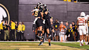 Oct 26, 2024; Nashville, Tennessee, USA;  Vanderbilt Commodores tight end Eli Stowers (9) celebrates with quarterback Diego Pavia (2) and wide receiver Richie Hoskins (5) after scoring a touchdown against the Texas Longhorns during the second half at FirstBank Stadium. Mandatory Credit: Steve Roberts-Imagn Images