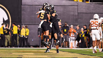 Oct 26, 2024; Nashville, Tennessee, USA;  Vanderbilt Commodores tight end Eli Stowers (9) celebrates with quarterback Diego Pavia (2) and wide receiver Richie Hoskins (5) after scoring a touchdown against the Texas Longhorns during the second half at FirstBank Stadium. Mandatory Credit: Steve Roberts-Imagn Images