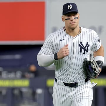 Oct 1, 2025; Bronx, New York, USA; New York Yankees right fielder Aaron Judge (99) runs in from right field after the top of the fourth inning of game two of the Wildcard round of the 2025 MLB playoffs against the Boston Red Sox at Yankee Stadium. Mandatory Credit: Brad Penner-Imagn Images