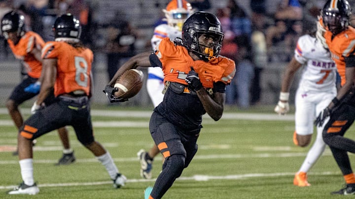 Lakeland's Shanard Clower returns a punt against Bartow on Friday night at Bryant Stadium.