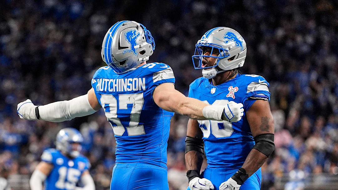 Detroit Lions defensive end Aidan Hutchinson (97) celebrates a sack against Pittsburgh Steelers with linebacker Al-Quadin Muhammad (96) during the first half at Ford Field in Detroit on Sunday, Dec. 21, 2025. Detroit Lions defensive end Aidan Hutchinson (97) celebrates a sack against Pittsburgh Steelers with linebacker Al-Quadin Muhammad (96) during the first half at Ford Field in Detroit on Sunday, Dec. 21, 2025.