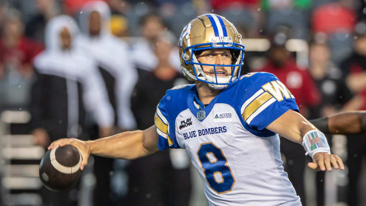 Jun 13, 2024; Ottawa, Ontario, CAN; Winnipeg Blue Bombers quarterback Zach Collards (8) sets up to throw the ball in the first hald against the Ottawa REDBLACKS at TD Place. Mandatory Credit: Marc DesRosiers-USA TODAY Sports