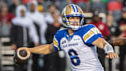 Jun 13, 2024; Ottawa, Ontario, CAN; Winnipeg Blue Bombers quarterback Zach Collards (8) sets up to throw the ball in the first hald against the Ottawa REDBLACKS at TD Place. Mandatory Credit: Marc DesRosiers-Imagn Images
