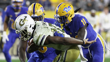 Oct 1, 2022; Pittsburgh, Pennsylvania, USA;  Pittsburgh Panthers defensive lineman Calijah Kancey (8) and linebacker Bangally Kamara (11) sack Georgia Tech Yellow Jackets quarterback Jeff Sims (10) during the second quarter at Acrisure Stadium. Mandatory Credit: Charles LeClaire-Imagn Images