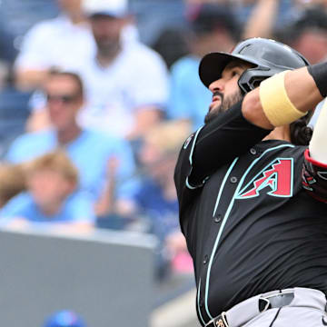 Jun 19, 2025; Toronto, Ontario, CAN;  Arizona Diamondbacks third baseman Eugenio Suarez (28) hits a two run home run against the Toronto Blue Jays in the second inning at Rogers Centre. Mandatory Credit: Dan Hamilton-Imagn Images