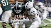 Nov 24, 2023; Detroit, Michigan, USA; Penn State Nittany Lions linebacker Keon Wylie (32) sacks Michigan State Spartans quarterback Katin Houser (12) during the second half at Ford Field. Mandatory Credit: David Reginek-Imagn Images