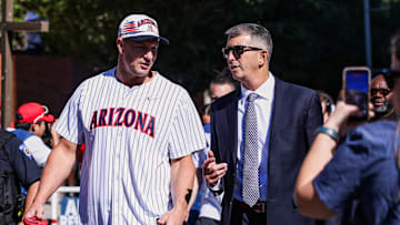 Oct 4, 2025; Tucson, Arizona, USA; Former professional and University of Arizona football player Rob Gronkowski walks down the Wildcat Walk with head coach Brent Brennan before the game against the Oklahoma State Cowboys at Arizona Stadium. Mandatory Credit: Aryanna Frank-Imagn Images