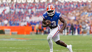 Oct 4, 2025; Gainesville, Florida, USA; Florida Gators running back Jadan Baugh (13) rushes with the ball against the Texas Longhorns during the first half at Ben Hill Griffin Stadium. Mandatory Credit: Matt Pendleton-Imagn Images