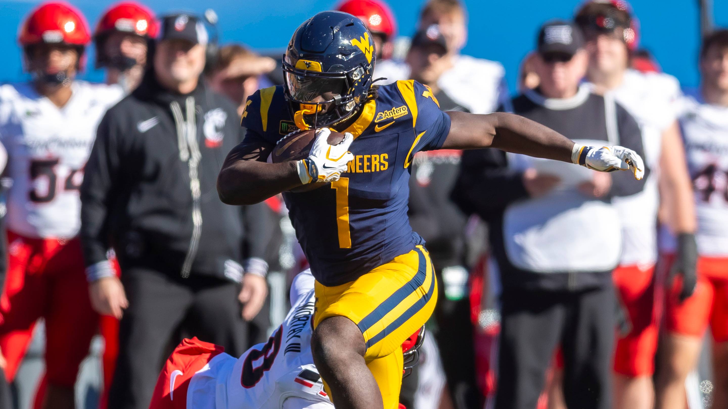 Oct 17, 2026; Morgantown, West Virginia, USA; West Virginia Mountaineers running back Amari Latimer (1) runs for extra yards during the fourth quarter against the Cincinnati Bearcats at Milan Puskar Stadium. Mandatory Credit: Ben Queen-Imagn Images | IMAGN IMAGES via Reuters Connect
