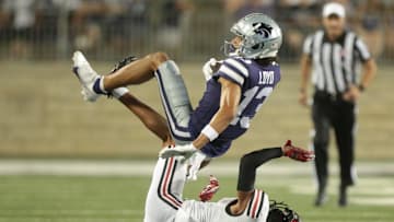 Kansas State sophomore wide receiver Xavier Loyd (13) rolls over Southeast Missouri State cornerback Ty Leonard in the third quarter of Saturday's game inside Bill Snyder Family Stadium.