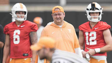 Tennessee quarterback Joey Aguilar (6) Tennessee head coach Josh Heupel and Tennessee quarterback Jake Merklinger (12) during Tennessee football preseason practice, in Knoxville, Tennessee, July 31, 2025.