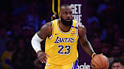 Los Angeles Lakers forward LeBron James brings the ball up court against the Minnesota Timberwolves.