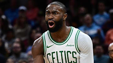 Nov 30, 2025; Cleveland, Ohio, USA; Boston Celtics guard Jaylen Brown (7) reacts after fouling Cleveland Cavaliers guard Donovan Mitchell (45) during the second half at Rocket Arena. Mandatory Credit: David Dermer-Imagn Images