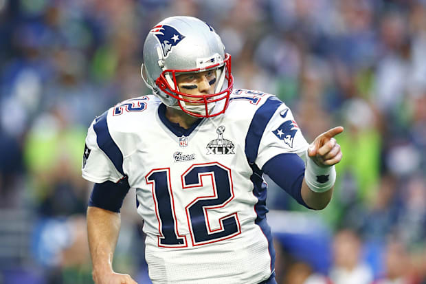 Feb 1, 2015; Glendale, AZ, USA; New England Patriots quarterback Tom Brady (12) reacts as he celebrates a touchdown pass in t