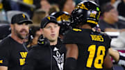 Arizona State head coach Kenny Dillingham greets linebacker Martell Hughes (18) during a game at Mountain America Stadium in Tempe on Sept. 26, 2025.