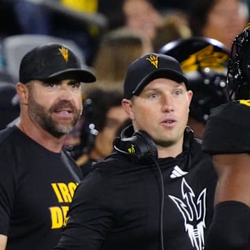 Arizona State head coach Kenny Dillingham greets linebacker Martell Hughes (18) during a game at Mountain America Stadium in Tempe on Sept. 26, 2025.
