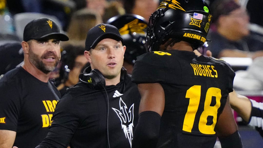 Arizona State head coach Kenny Dillingham greets linebacker Martell Hughes (18) during a game at Mountain America Stadium in Tempe on Sept. 26, 2025.