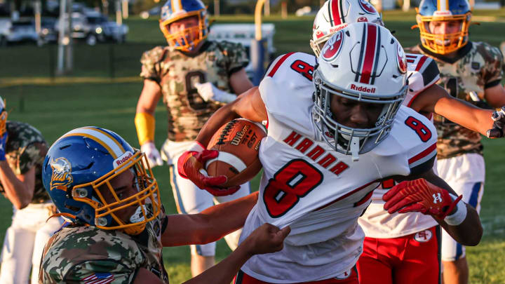 Bryan Mitzel (2) pulls down Lex Cyrus (8) along the near sideline. The Northern Lebanon Vikings played host to the Susquehanna Twp. Indians Friday September 1, 2023. The Indians defeated the Vikings 42-14.