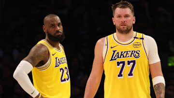 Los Angeles Lakers forward LeBron James (23) and guard Luka Doncic (77) during the second quarter against the Charlotte Hornets at Crypto.com Arena.
