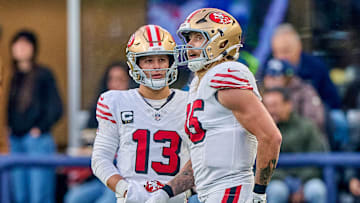 San Francisco 49ers quarterback Brock Purdy (13) and tight end George Kittle (85)