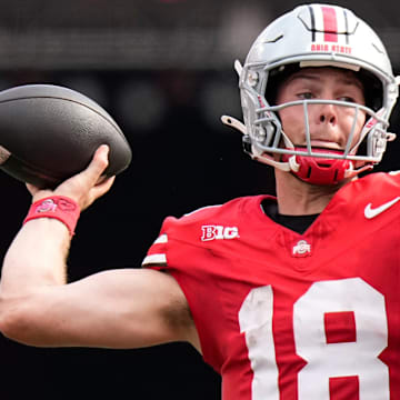 Aug 31, 2024; Columbus, OH, USA; Ohio State Buckeyes quarterback Will Howard (18) throws during the NCAA football game against the Akron Zips at Ohio Stadium. Ohio State won 52-6.