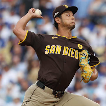 Oct 11, 2024; Los Angeles, California, USA; San Diego Padres pitcher Yu Darvish (11) pitches against the Los Angeles Dodgers in the first inning during game five of the NLDS for the 2024 MLB Playoffs at Dodger Stadium. Mandatory Credit: Kiyoshi Mio-Imagn Images