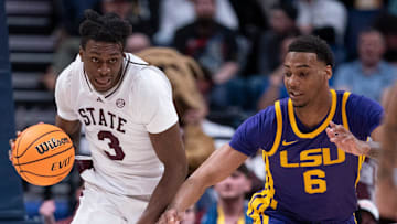Mississippi State Bulldogs forward KeShawn Murphy (3) dribbles up court against LSU Tigers forward Robert Miller III (6) during their first round game of the SEC Men's Basketball Tournament at Bridgestone Arena in Nashville, Tenn., Wednesday, March 12, 2025.