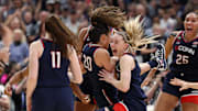 Bueckers celebrates with her teammates after UConn's national championship win. 