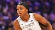 Oct 10, 2025; Phoenix, Arizona, USA; Las Vegas Aces guard Jackie Young (0) controls the ball against the Phoenix Mercury during the first half of game four of the 2025 WNBA Finals at Mortgage Matchup Center. Mandatory Credit: Joe Camporeale-Imagn Images