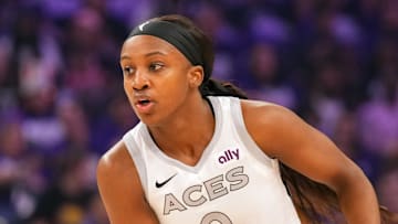 Oct 10, 2025; Phoenix, Arizona, USA; Las Vegas Aces guard Jackie Young (0) controls the ball against the Phoenix Mercury during the first half of game four of the 2025 WNBA Finals at Mortgage Matchup Center. Mandatory Credit: Joe Camporeale-Imagn Images