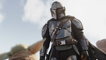 (L-R): Grogu and Din Djarin (Pedro Pascal) in Lucasfilm's THE MANDALORIAN, season three, exclusively on Disney+. ©2023 Lucasfilm Ltd. & TM. All Rights Reserved.