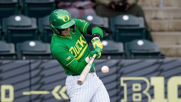 Oregon infielder/outfielder Drew Smith hits a triple as the Oregon Ducks host the Youngstown State Penguins on Feb. 19, 2026, at PK Park in Eugene, Oregon.