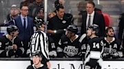 Nov 20, 2024; Los Angeles, California, USA;  Los Angeles Kings head coach Jim Hiller (back row on right) talks to an official during the third period at Crypto.com Arena. Mandatory Credit: Kiyoshi Mio-Imagn Images
