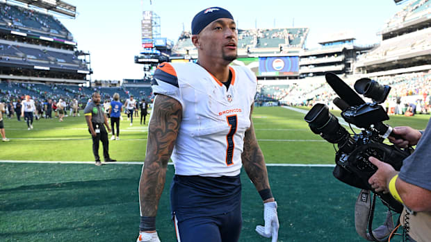 Denver Broncos tight end Evan Engram (1) walks off the field after win against the Philadelphia Eagles at Lincoln Financial F