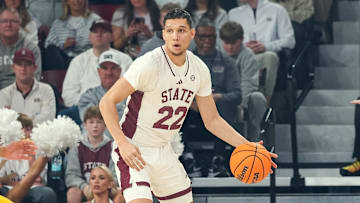Feb 1, 2025; Starkville, Mississippi, USA; Mississippi State Bulldogs forward RJ Melendez (22) handles the ball against Missouri Tigers guard Tamar Bates (2) during the first half at Humphrey Coliseum. Mandatory Credit: Wesley Hale-Imagn Images