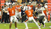 Oct 18, 2025; Charlottesville, Virginia, USA; Virginia Cavaliers quarterback Chandler Morris (4) passes the ball as Washington State Cougars defensive lineman Malaki Ta'Ase (98) chases in the first quarter at Scott Stadium. Mandatory Credit: Geoff Burke-Imagn Images