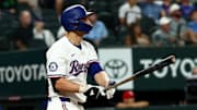 Aug 27, 2025; Arlington, Texas, USA;  Texas Rangers shortstop Corey Seager (5) hits a two-run home run during the fourth inning against the Los Angeles Angels at Globe Life Field. 