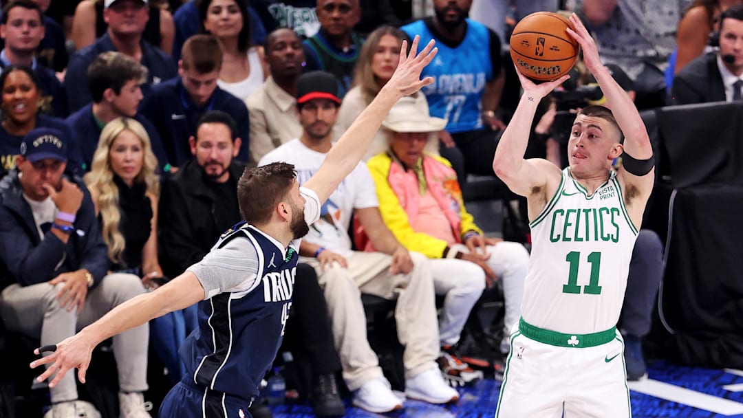 Jun 14, 2024; Dallas, Texas, USA; Boston Celtics guard Payton Pritchard (11) shoots the ball against Dallas Mavericks forward Maxi Kleber (42) during game four of the 2024 NBA Finals at American Airlines Center. Mandatory Credit: Peter Casey-Imagn Images