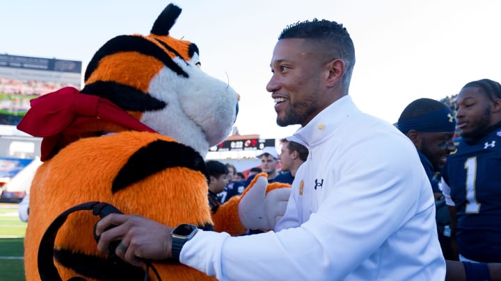 Notre Dame head football coach Marcus Freeman hugs Tony the Tiger after his 40-8 win against Oregon State in the 90th annual Sun Bowl game on Friday, Dec. 29, 2023, at El Paso, Texas.