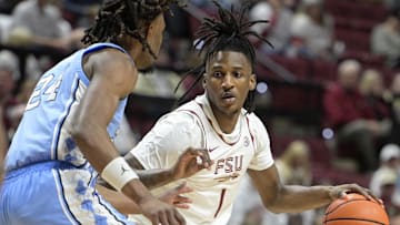 Feb 24, 2025; Tallahassee, Florida, USA;  Florida State Seminoles forward Jamir Watkins (1) is defended by North Carolina Tarheels Jae'Lyn Withers (24) during the first half at Donald L. Tucker Center. Mandatory Credit: Melina Myers-Imagn Images