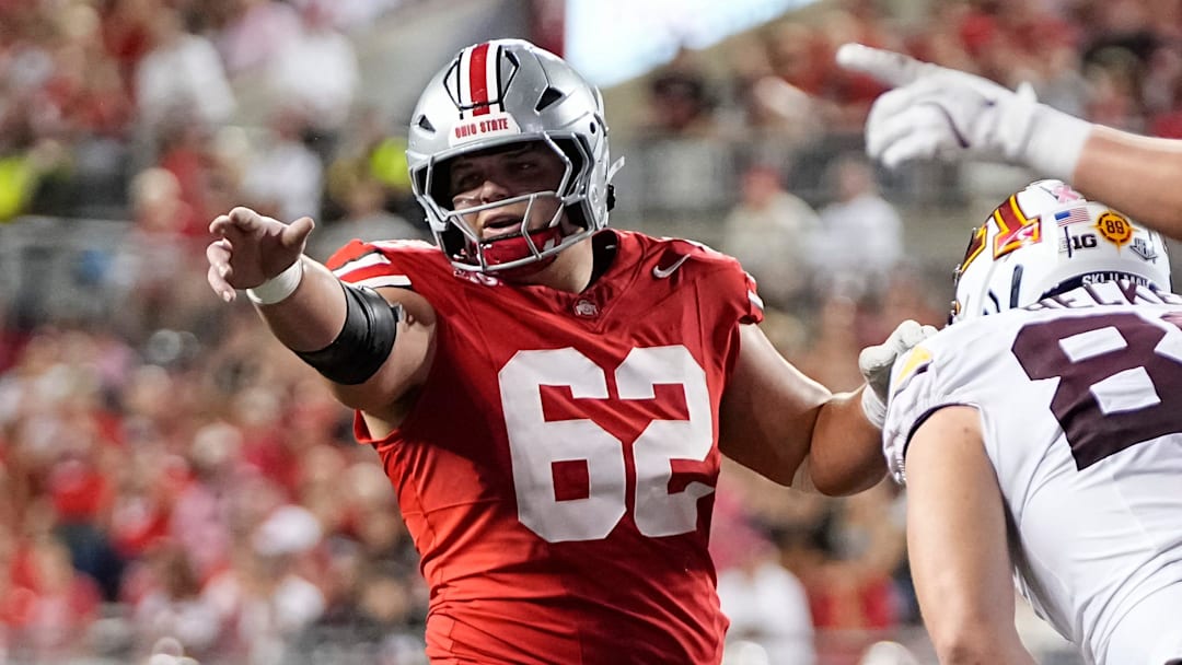 Ohio State Buckeyes offensive lineman Joshua Padilla (62) motions during the NCAA football game against the Minnesota Golden Gophers at Ohio Stadium in Columbus on Oct. 4, 2025.