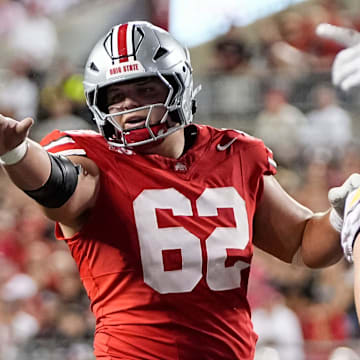 Ohio State Buckeyes offensive lineman Joshua Padilla (62) motions during the NCAA football game against the Minnesota Golden Gophers at Ohio Stadium in Columbus on Oct. 4, 2025.