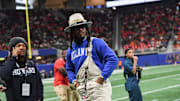 Dec. 16, 2023; Atlanta, Georgia, USA; Football star Cam Newton stands on the sidelines during the Cricket Celebration Bowl game between Florida A&M University and Howard University at Mercedes-Benz Stadium. FAMU defeated Howard 30-26.